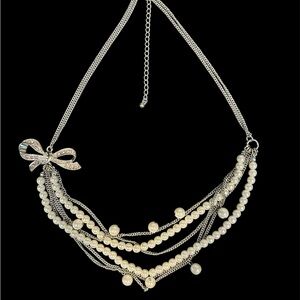 Elegant Faux Pearl and Silver Necklace with Bow Accent